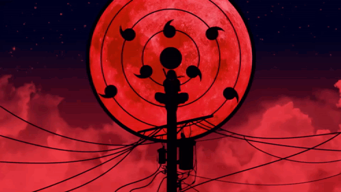 A Silhouette Of A Telephone Pole In Front Of A Red Moon GIF