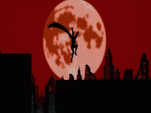 A Silhouette Of Batman Flying In Front Of A Red Full Moon GIF