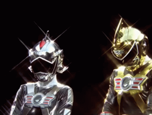 A Silver And A Gold Superhero With The Letter E On Their Chest GIF