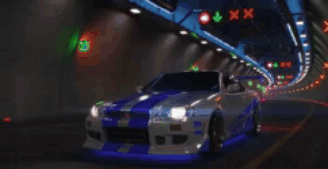 A Silver And Blue Car Is Driving Through A Tunnel At Night GIF