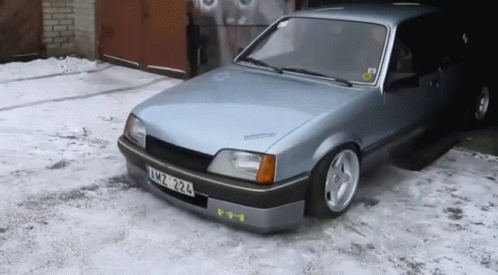 A Silver Car With A License Plate That Says Xmz 324 GIF