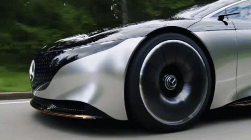 A Silver Car With A Mercedes Logo On The Front GIF