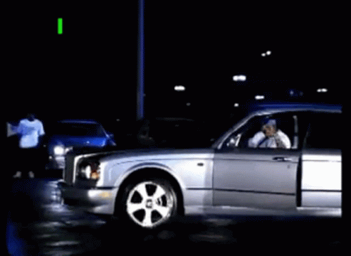 A Silver Car With The Words " I Puts In Werk " On The Top GIF