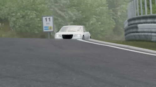 A Silver Chrysler Car Is Driving Down A Highway GIF