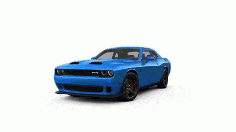 A Silver Dodge Challenger Srt Hellcat Is Sitting On A White Surface . GIF