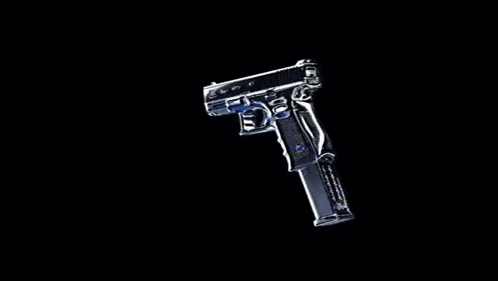 A Silver Gun With A Magazine Is Sitting On A Black Background . GIF