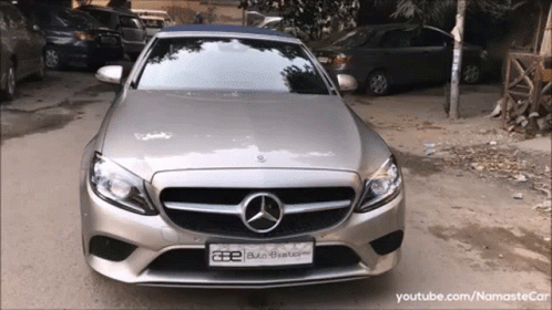 A Silver Mercedes With A License Plate That Says Ae GIF