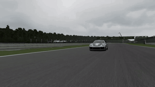 A Silver Sports Car Is Driving On A Track With A Sign That Says ' Allianz ' On It GIF