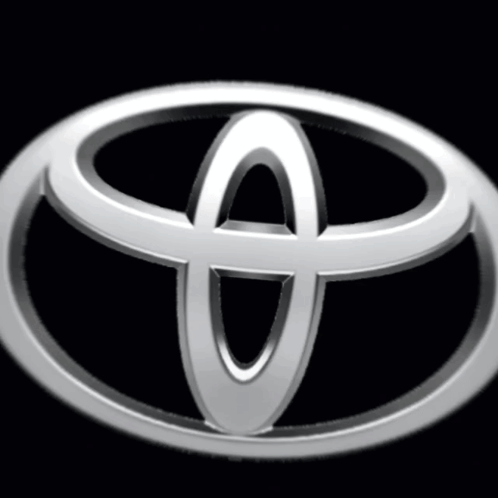 A Silver Toyota Logo Is Against A Black Background GIF