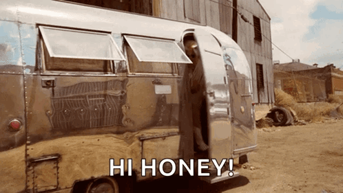 A Silver Trailer That Says Hi Honey On The Side GIF