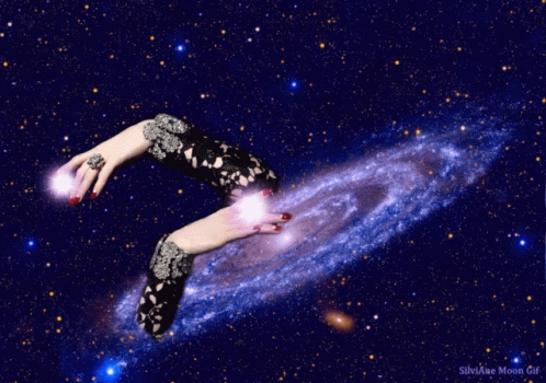 A Silviae Moon Gif Shows A Woman 'S Hands Reaching Out Towards A Spiral Galaxy GIF