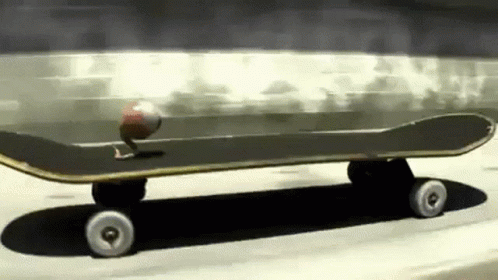 A Skateboard With A Ball On It Is Going Down A Road GIF