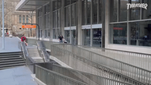 A Skateboarder Is Doing A Trick In Front Of A Thrasher Building GIF