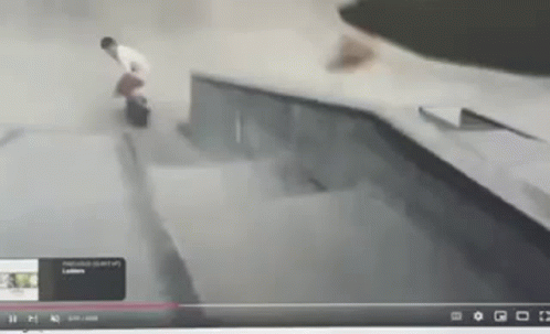 A Skateboarder Is Doing A Trick On A Ramp In A Video GIF
