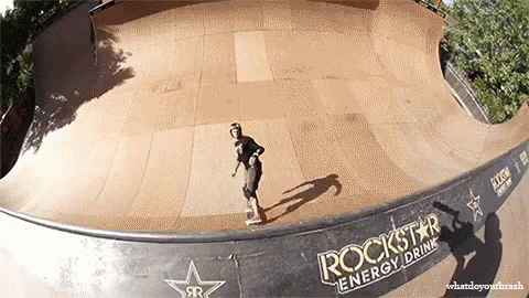 A Skateboarder Is Doing A Trick On A Ramp That Says Rockstar Energy Drink On It GIF
