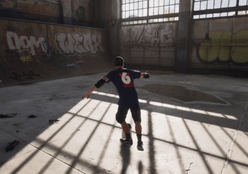 A Skateboarder With The Number 6 On His Back GIF