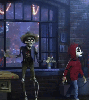 A Skeleton In A Cowboy Hat Is Standing In Front Of A Brick Wall GIF