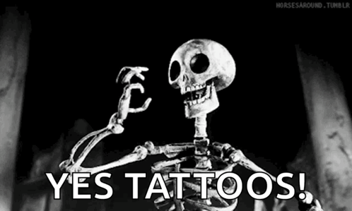 A Skeleton Is Flexing His Muscles In A Black And White Photo With The Words `` Yes Tattoos '' . GIF