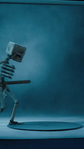 A Skeleton Is Holding A Sword In His Hand GIF