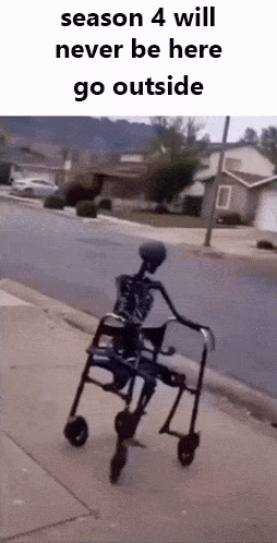 A Skeleton Is Riding A Walker Down A Sidewalk On A Sidewalk . GIF