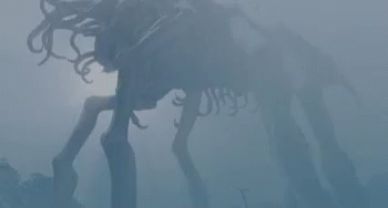 A Skeleton Of A Horse Is Standing In The Fog In The Dark . GIF