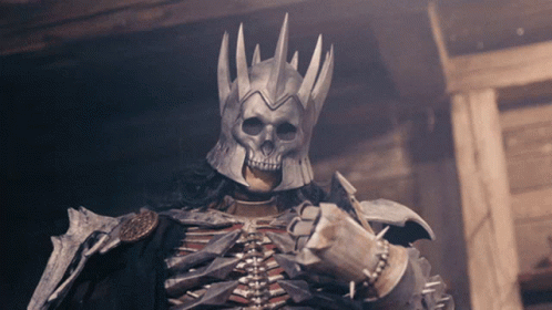 A Skeleton Wearing A Helmet With A Skull Face GIF