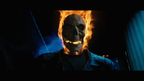 A Skeleton With Flames Coming Out Of It 'S Head GIF