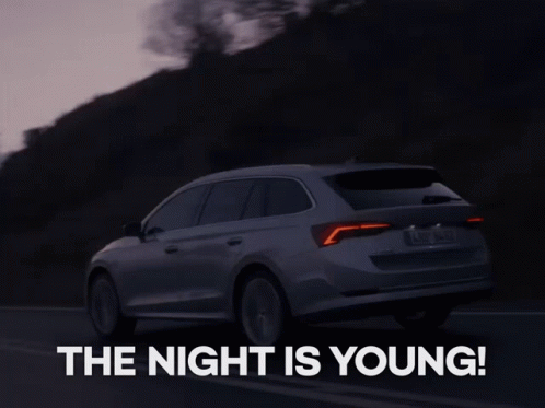 A Skoda Car Is Driving Down A Road At Night GIF
