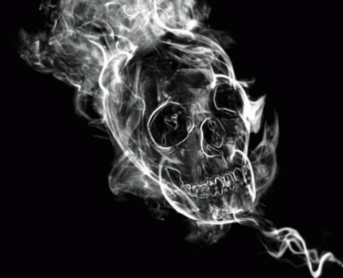 A Skull With Smoke Coming Out Of It On A Black Background GIF