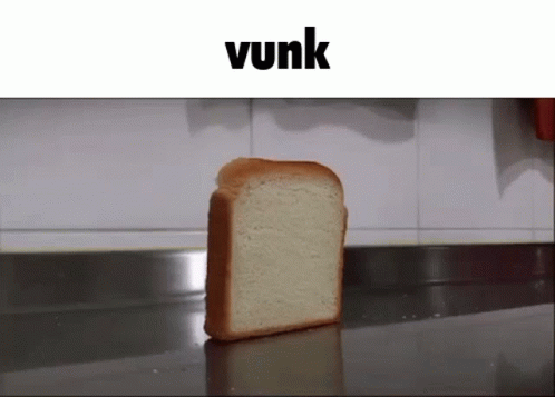 A Slice Of Bread Sits On A Counter Under A Banner That Says Vunk GIF