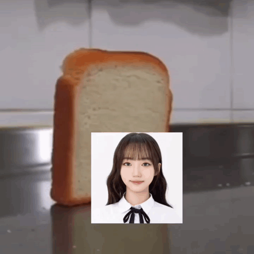 A Slice Of Bread With A Picture Of A Girl On It GIF
