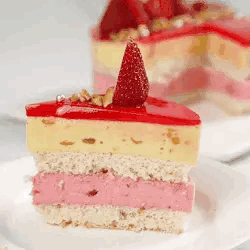 A Slice Of Cake With Strawberries On Top Of It Is On A White Plate . GIF