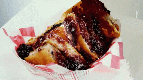 A Slice Of French Toast With A Berry Sauce On Top GIF