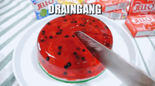 A Slice Of Watermelon Jello Is Being Taken Out Of It GIF