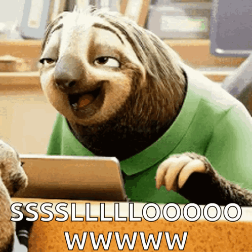 A Sloth Wearing A Green Shirt Is Sitting At A Table With A Tablet And Says Sssllloooo Wwwww GIF