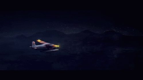 A Small Plane With A Red Bull Logo On The Side Is Flying In The Night Sky GIF