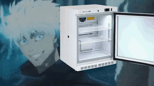 A Small White Fridge With The Door Open And A Man Behind It GIF