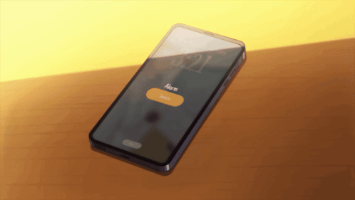 A Smart Phone Displays An Alarm Clock On Its Screen GIF