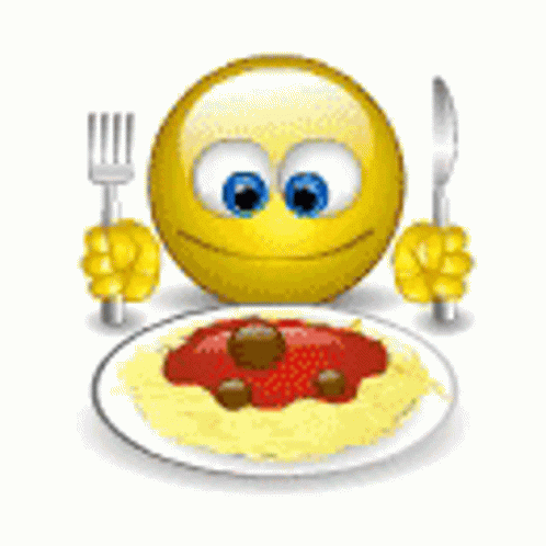 A Smiley Face Is Holding A Fork And Knife In Front Of A Plate Of Spaghetti And Meatballs . GIF