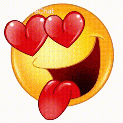 A Smiley Face With Two Red Hearts In Its Eyes And A Tongue Sticking Out GIF