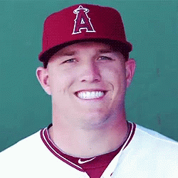 A Smiling Baseball Player Wearing A Red A Hat GIF