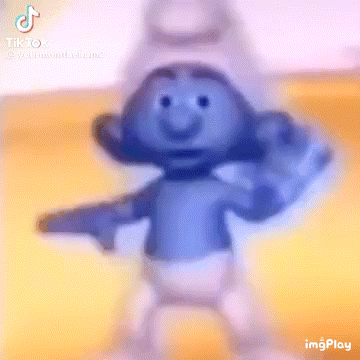 A Smurf Is Dancing And Pointing At The Camera With A Gun . GIF