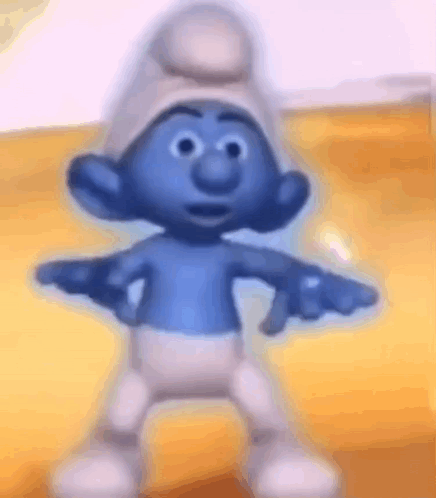 A Smurf Is Dancing With His Arms Outstretched And Wearing A Hat . GIF