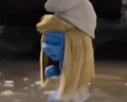 A Smurf Wearing A White Hat And Blonde Hair GIF
