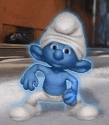 A Smurf With A White Hat And Blue Pants Is Standing In The Snow GIF