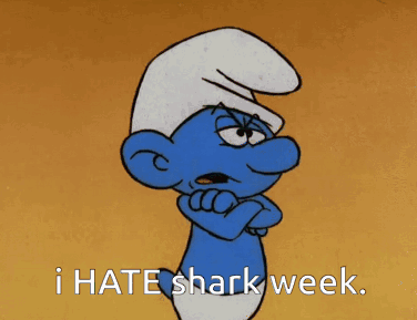 A Smurf With His Arms Crossed And The Words I Hate Shark Week GIF