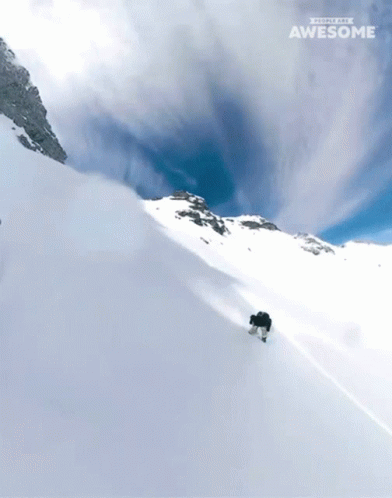 A Snowboarder Is Going Down A Snow Covered Slope With The Words " People Are Awesome " On The Bottom GIF