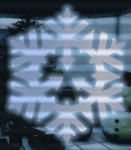 A Snowflake Is Visible In A Dark Room GIF