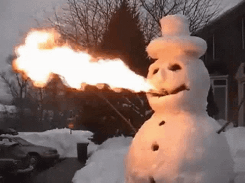 A Snowman Is Holding A Torch In His Mouth . GIF