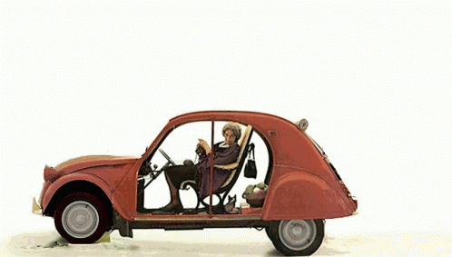 A Snowman Is Standing Next To A Car With A Christmas Tree On Top GIF